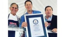 Men being awareded with Guinness World Record for Largest Pot of Seafood Gumbo