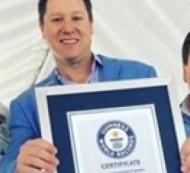 Men being awareded with Guinness World Record for Largest Pot of Seafood Gumbo